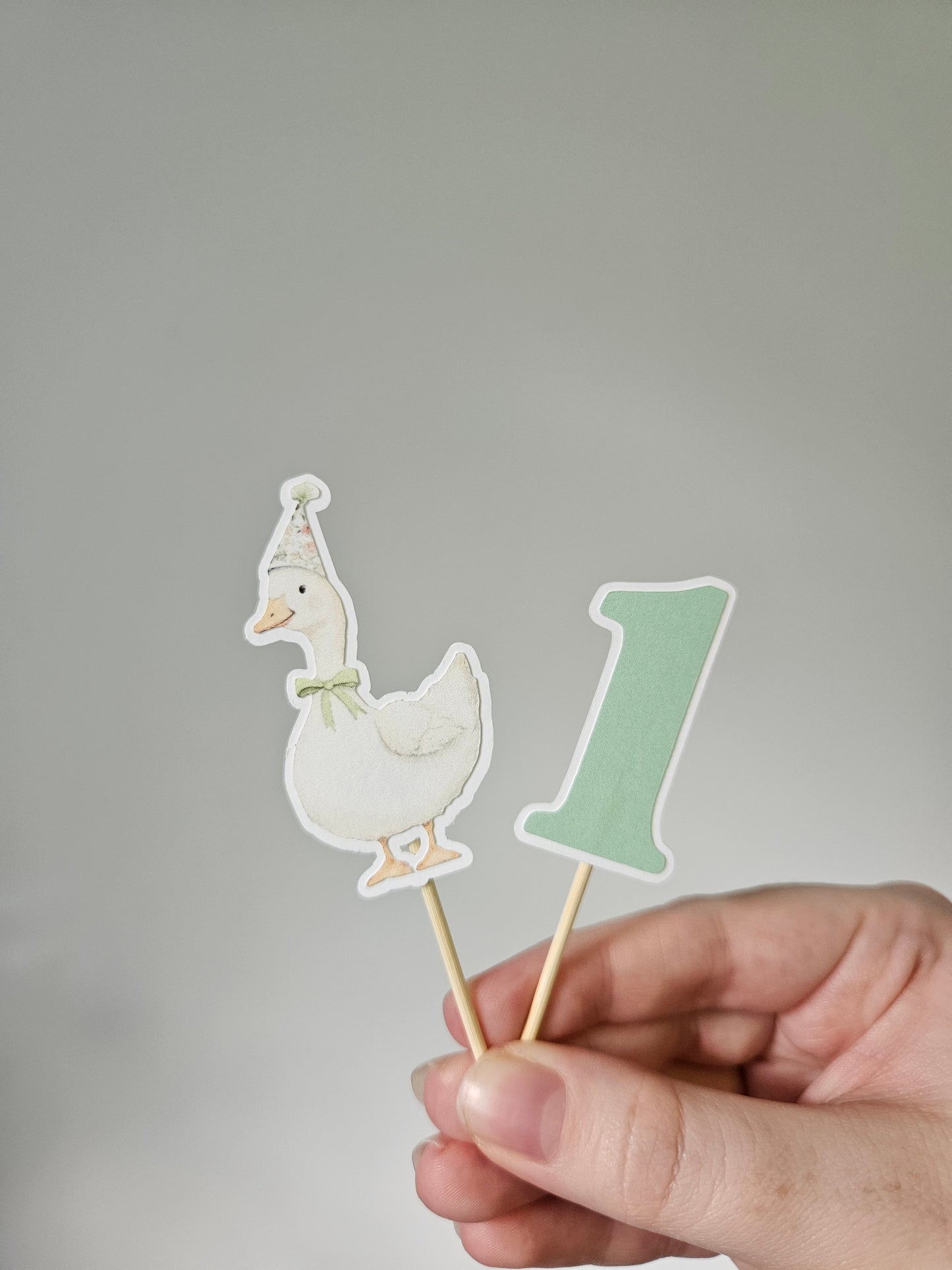 goose and one cupcake topper on white background