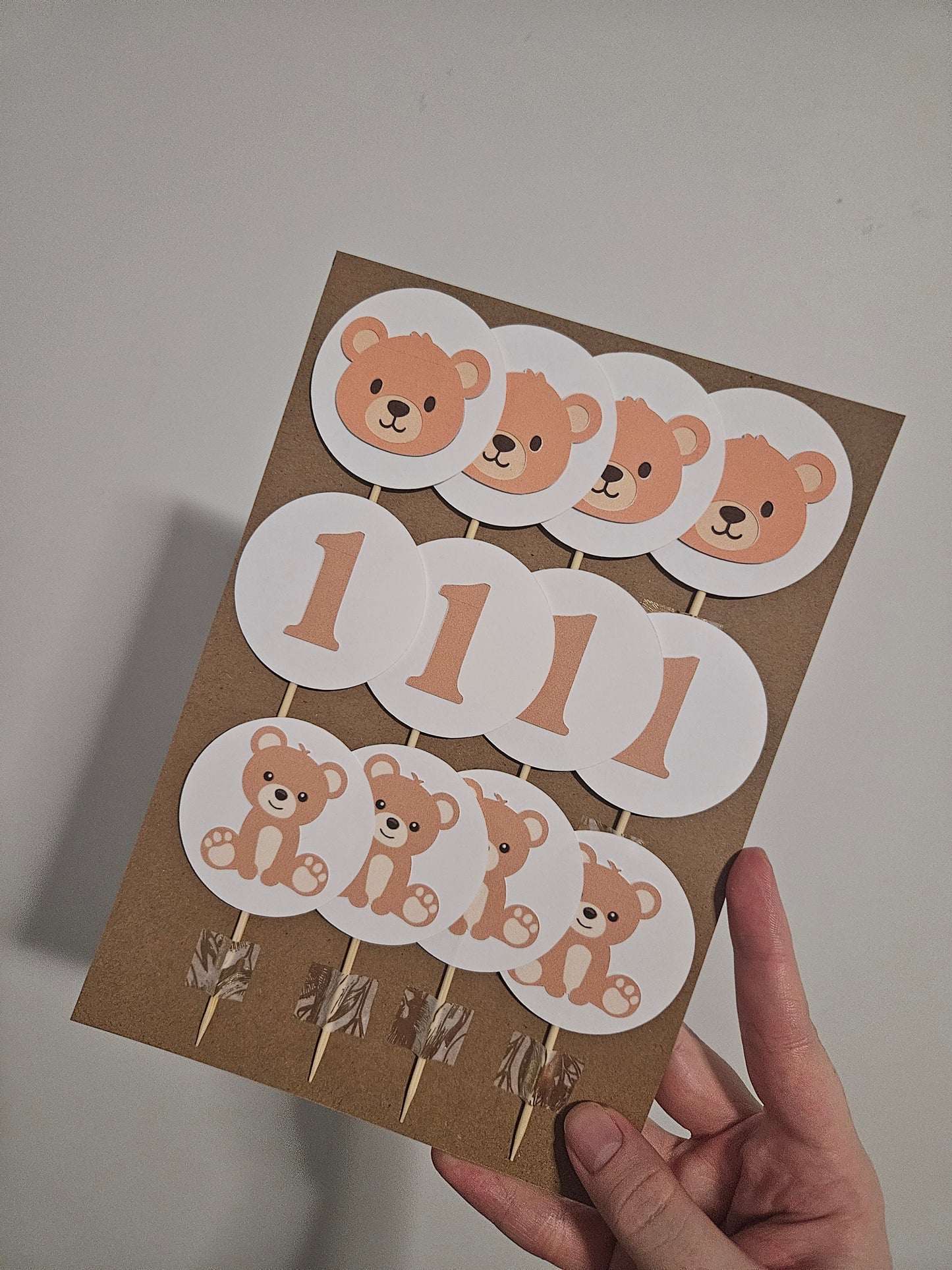 teddy bear and one cupcake toppers on card backing