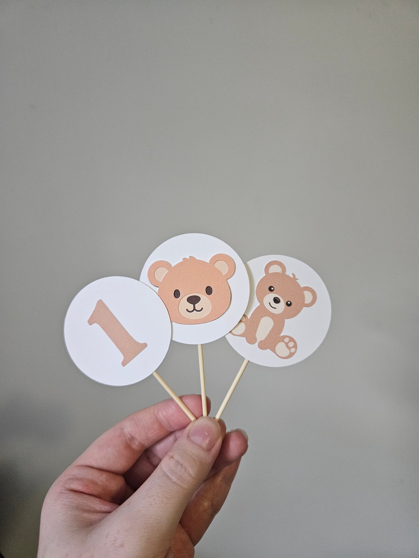 Circle teddy bear cupcake toppers on white background