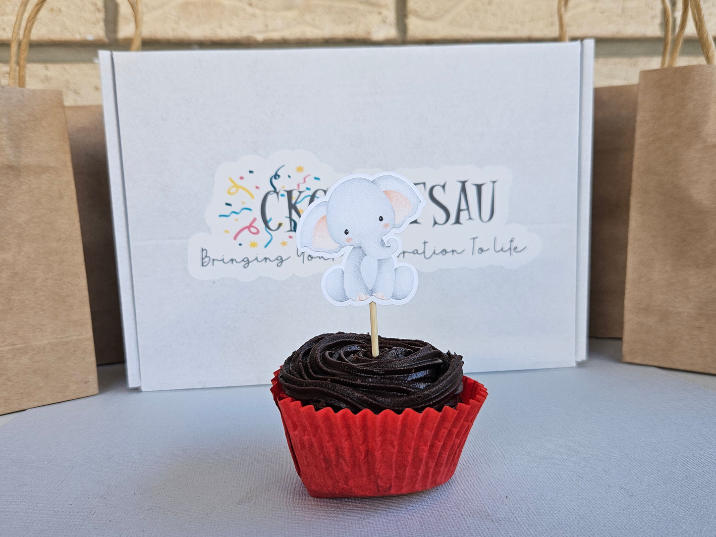 Cupcake with Elephant topper on branding backing