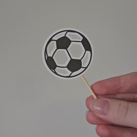 Video of soccer ball topper on white background