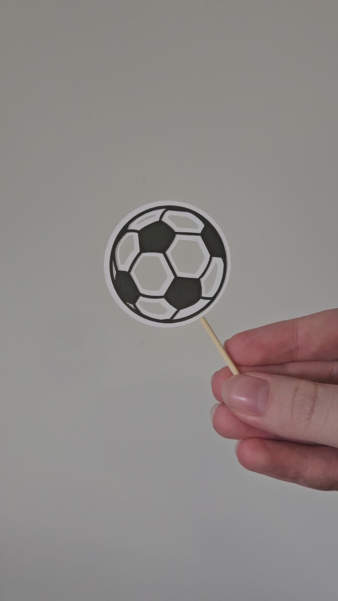 Video of soccer ball topper on white background