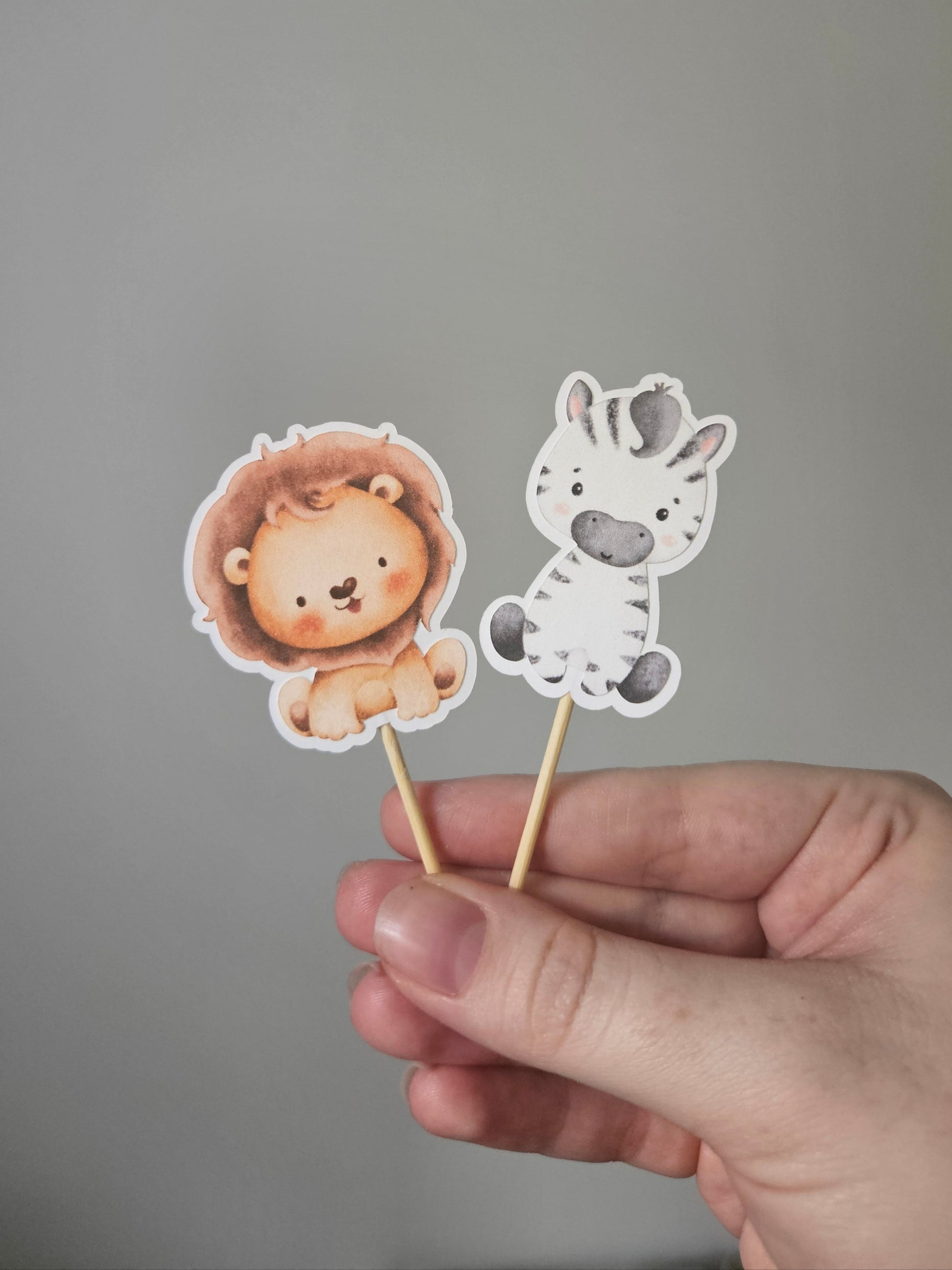 Lion and Zebra toppers on white background
